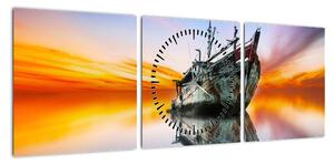 Obraz - Wschód słońca nad wrakiem łodzi (z zegarem) (90x30 cm)