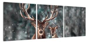 Obraz - Jeleń i łania w zaśnieżonym lesie (z zegarem) (90x30 cm)