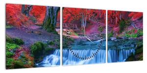 Obraz wodospadu w czerwonym lesie (z zegarem) (90x30 cm)