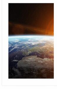 Plakat z passe-partout widok planety z kosmosu