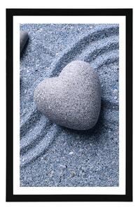 Plakat z passe-partout serce z kamienia na piaszczystym tle