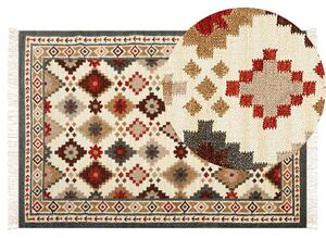 Ręcznie tkany dywan wełniany do salonu wielokolorowy kilim 140 x 200 cm Ghukasavan Beliani