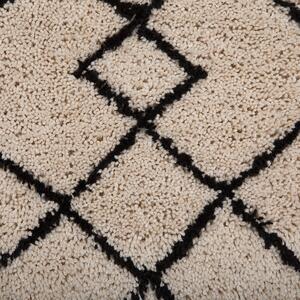 Nowoczesny dywan 140 x 200 cm z geometrycznym wzorem beżowo-czarny Havsa Beliani