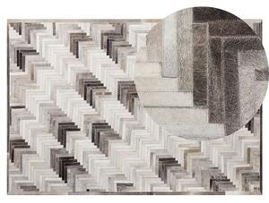 Dywan szaro-beżowy prostokątny skórzany patchwork efekt 3d 140 x 200 cm Arsuz Beliani