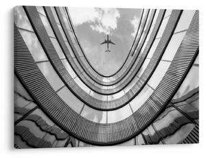 Obraz - Samolot nad budynkiem (70x50 cm)
