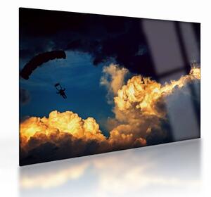 Obraz na szkle skoczka spadochronowego w chmurach (70x50 cm)