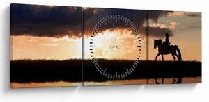 Obraz - Jeździec na koniu o zachodzie słońca (z zegarem) (90x30 cm)