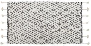 Dywan bawełniany geometryczny wzór z frędzlami 80x150cm biały czarny Agadir Beliani