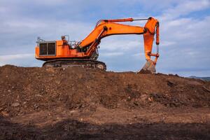 Ilustracja Backhoe are working digging on the ground, voranat