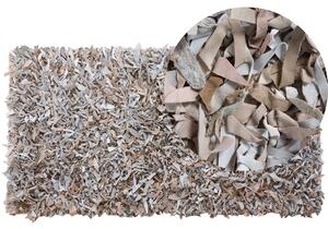 Ręcznie tkany dywan skórzany shaggy 80 x 150 cm jasnobeżowy Mut Beliani
