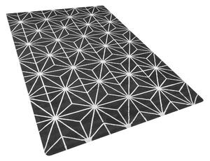Nowoczesny dywan z wiskozy 140 x 200 cm złoty geometryczny wzór czarny Sibel Beliani