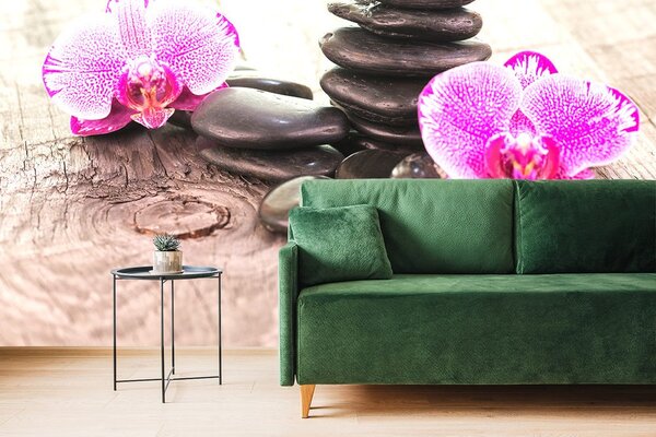 Fototapeta orchidea i zen kamienie na drewnie