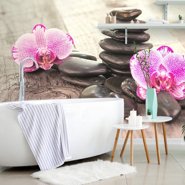 Fototapeta orchidea i zen kamienie na drewnie