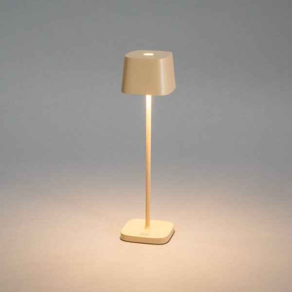 Konstsmide Lampa stołowa LED Capri, wysokość 25 cm, kolor piaskowy, IP54 możliwość ściemniania, kremowy / amber, salon / jadalnia, aluminium, nowoczesny
