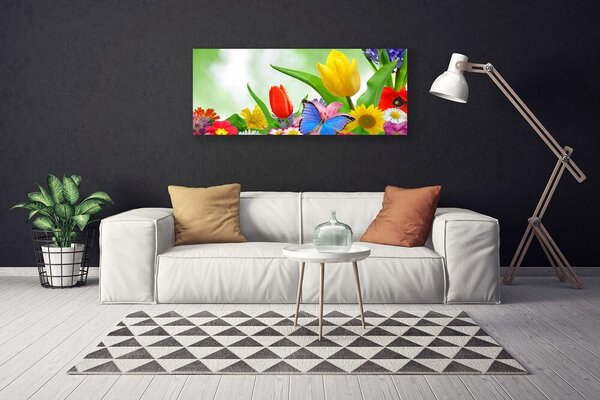 Obraz canvas Kolorowy Motyl wśród Płatków
