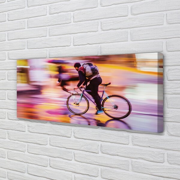 Obraz canvas na ścianę Rowerzysta w Blasku Świateł