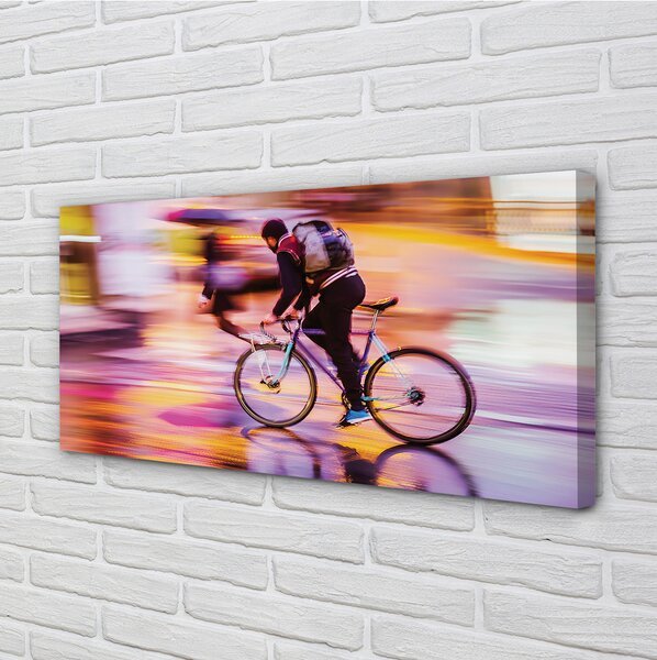 Obraz canvas na ścianę Rowerzysta w Blasku Świateł