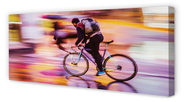 Obraz canvas na ścianę Rowerzysta w Blasku Świateł