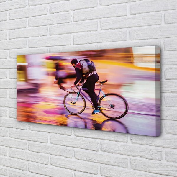 Obraz canvas na ścianę Rowerzysta w Blasku Świateł