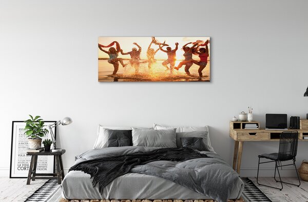 Obraz canvas na ścianę Ludzie nad Morzem o Zachodzie