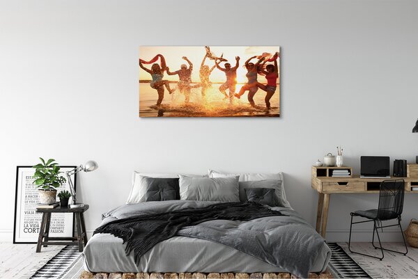 Obraz canvas na ścianę Ludzie nad Morzem o Zachodzie