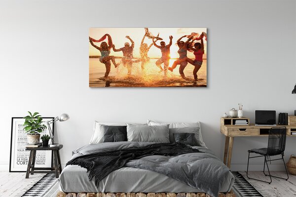 Obraz canvas na ścianę Ludzie nad Morzem o Zachodzie