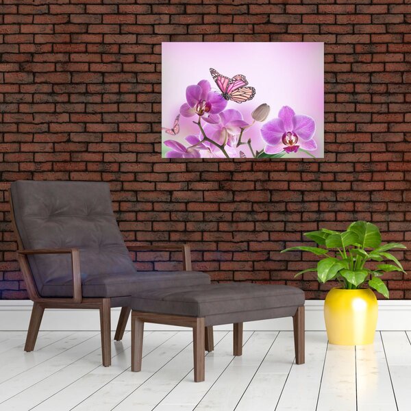 Obraz - Motyl na kwiatach orchidei, liliowy (70x50 cm)