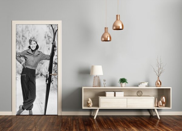 Naklejka fototapeta na drzwi Kobieta z nartami