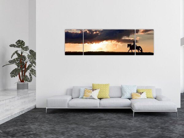 Obraz - Jeździec na koniu o zachodzie słońca (170x50 cm)
