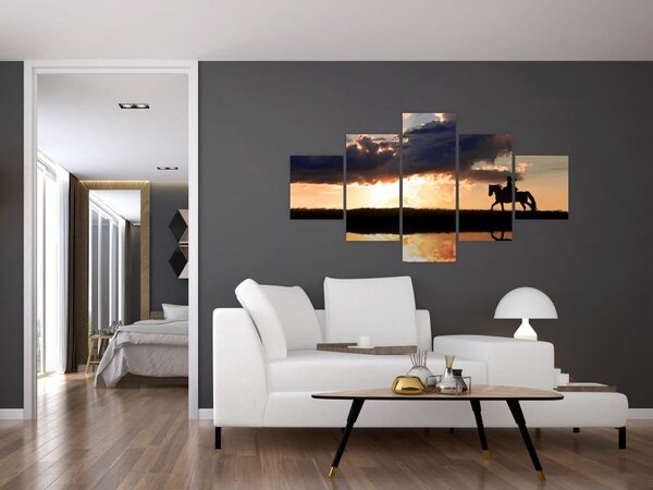 Obraz - Jeździec na koniu o zachodzie słońca (125x70 cm)