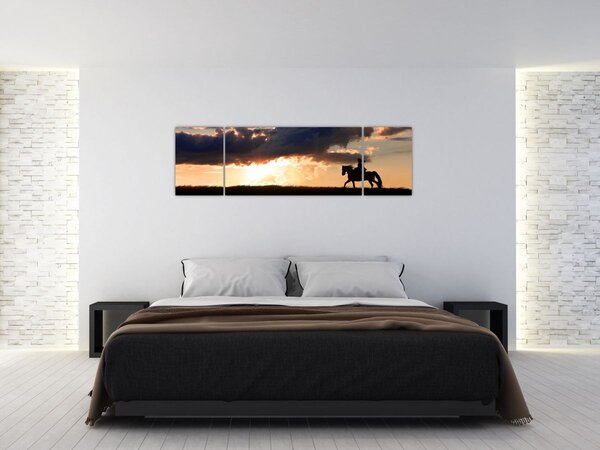 Obraz - Jeździec na koniu o zachodzie słońca (170x50 cm)