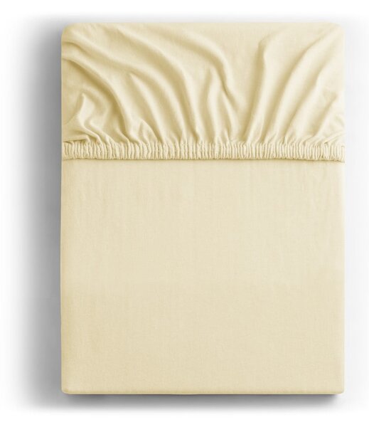 Kremowe dżersejowe prześcieradło z gumką 240x200 cm Amber – Restilo