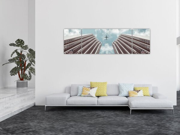 Obraz samolotu między budynkami (170x50 cm)