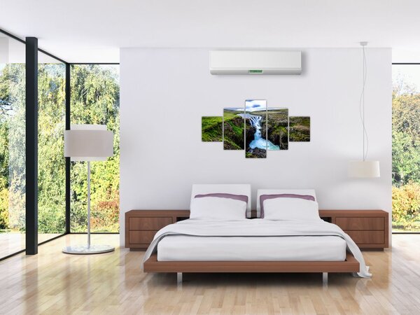 Obraz wodospadu między skałami (125x70 cm)