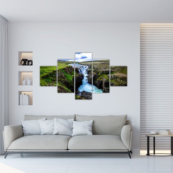 Obraz wodospadu między skałami (125x70 cm)