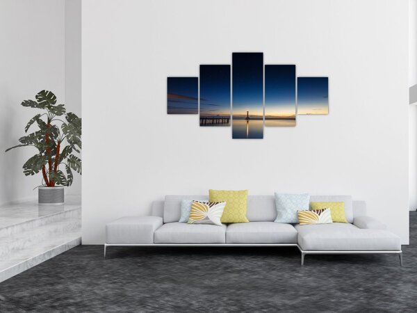 Obraz latarni morskiej w oddali (125x70 cm)