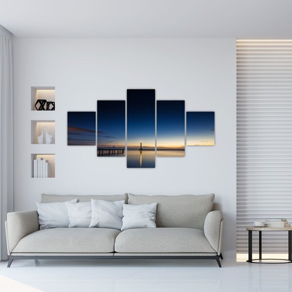 Obraz latarni morskiej w oddali (125x70 cm)