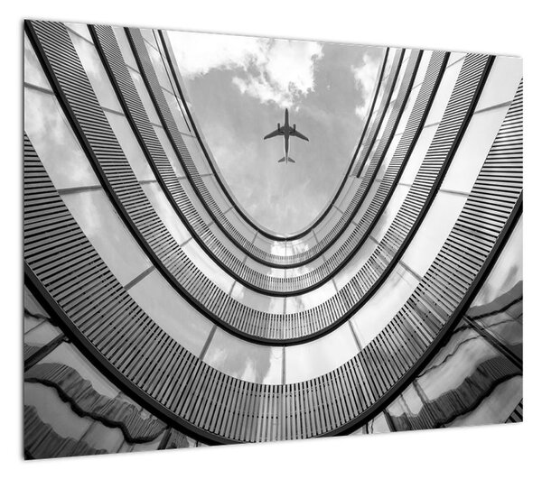 Obraz - Samolot nad budynkiem (70x50 cm)