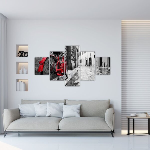 Obraz czerwonego roweru na brukowanej uliczce (125x70 cm)