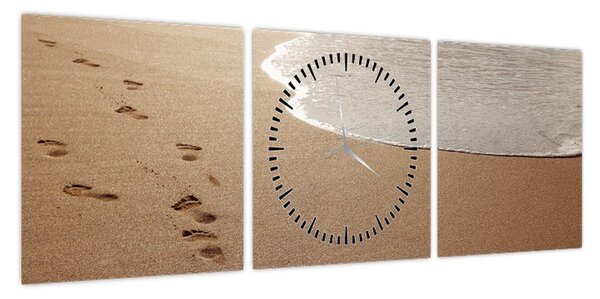 Obraz - ślady stóp na piasku i morzu (z zegarem) (90x30 cm)