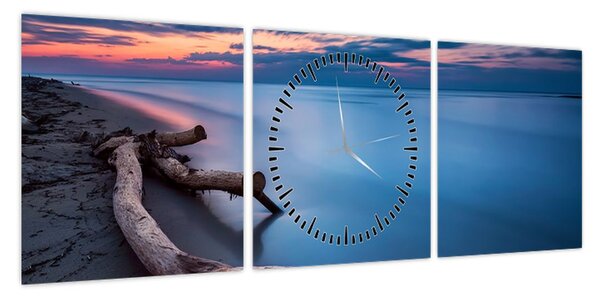 Obraz plaży o zachodzie słońca (z zegarem) (90x30 cm)