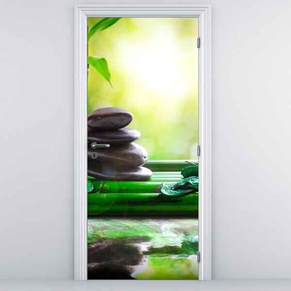 Fototapeta na drzwi - Kamienie do masażu i orchidea na wodzie (95x205cm)