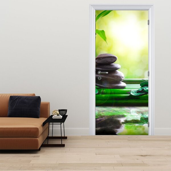Fototapeta na drzwi - Kamienie do masażu i orchidea na wodzie (95x205cm)