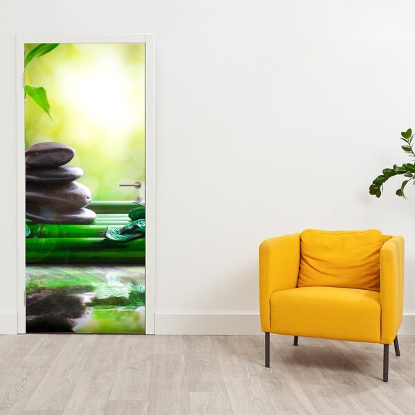 Fototapeta na drzwi - Kamienie do masażu i orchidea na wodzie (95x205cm)