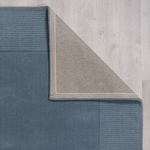 Ciemnoniebieski wełniany dywan tkany ręcznie 120x170 cm Textured Wool Border – Flair Rugs