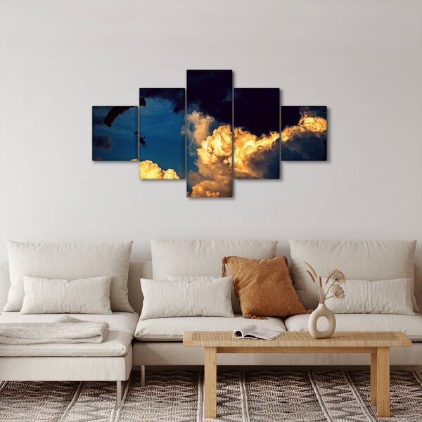Obraz skoczka spadochronowego w chmurach (125x70 cm)