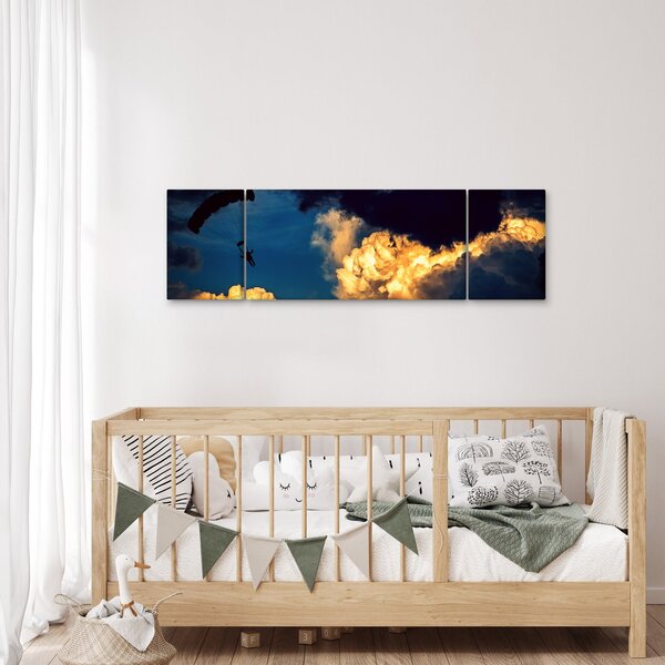 Obraz skoczka spadochronowego w chmurach (170x50 cm)
