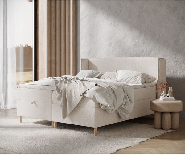 Kremowe łóżko boxspring ze schowkiem 160x200 cm Monpelli – Maison de Rêve