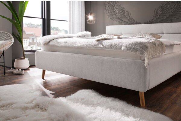 Jasnoszare tapicerowane łóżko dwuosobowe ze schowkiem ze stelażem 180x200 cm Lotte – Meise Möbel
