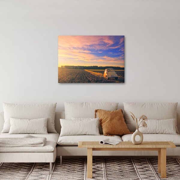Obraz żółtego samochodu na polu (70x50 cm)